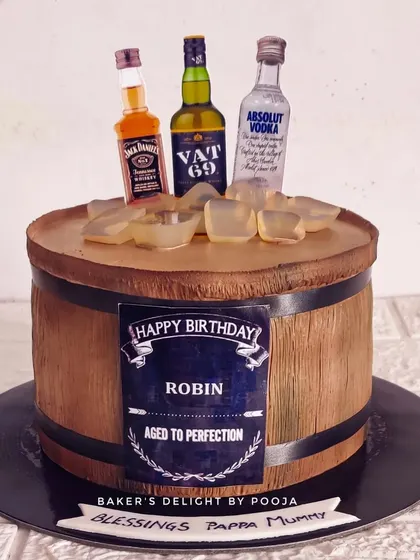 A non-fondant barrel cake, a design that was very popular a couple of years ago. This one was a special request from a client, and I was happy to bring back this classic whisky barrel look.