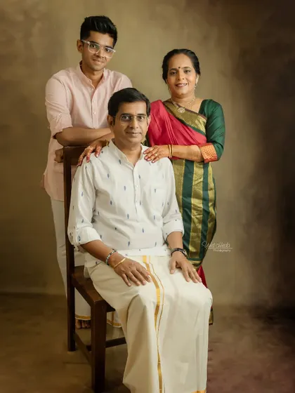 A classic, formal portrait of the family, celebrating a special milestone with elegance and grace.