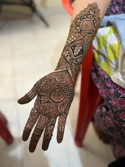 This is a detailed view of my intricate bridal henna work. Each design is unique, combining traditional patterns like paisleys and mandalas with fine-line fillers to create a stunning, full-coverage look for your special day.