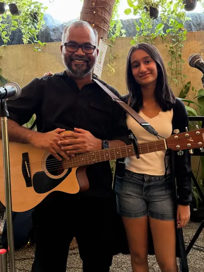 One of our main performers posing with a young artist. We encourage and support artists of all ages to share their passion.