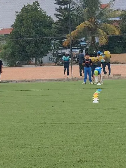 A wide view of a fielding session during our summer camp. We accommodate large groups while ensuring every player is engaged.