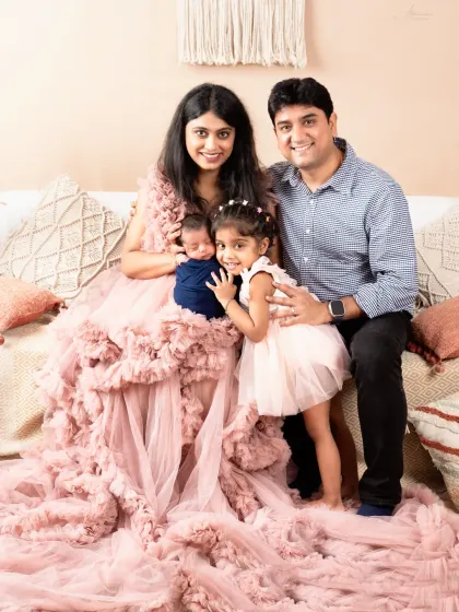 A picture of a perfect family of four. We love capturing the moment a family grows.