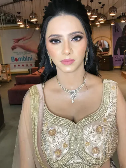 A direct portrait showing the symmetry and precision of the makeup application. The soft contouring enhances her facial structure beautifully.