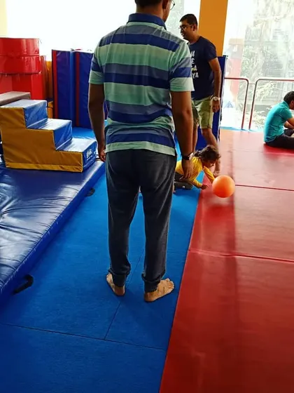 A Sunday morning class full of fun. Toddlers play with balls, which helps improve their hand-eye and foot-eye coordination in a dynamic group setting.