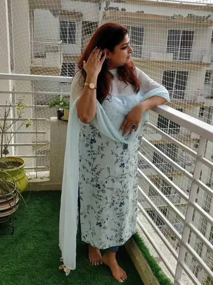 Another shot of our client enjoying her comfortable and stylish custom-made suit.