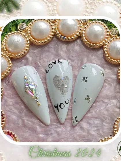 A collection of various nail art designs, from abstract and animal prints to delicate florals and 3D textures, all beautifully framed for the Christmas season.