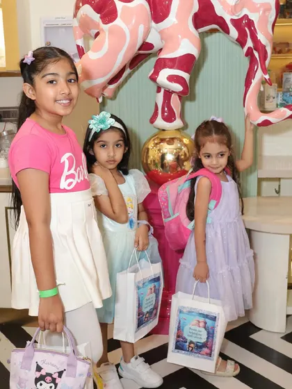 Young guests with their party favor bags, ready to go home after a fun-filled day.