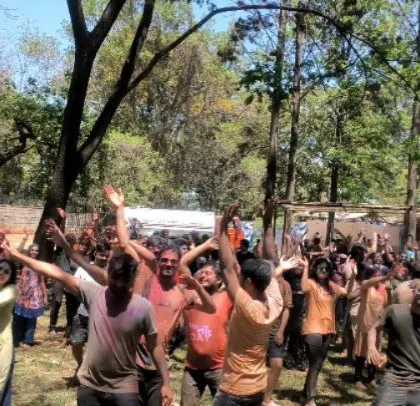 A daytime Holi party for over 2,000 people. Even in daylight, the energy is palpable as the crowd dances, covered in colors.