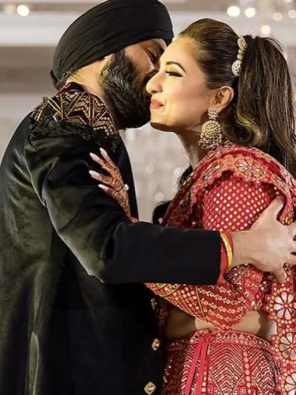 A sweet, candid moment between the bride and groom. My choreography aims to create these opportunities for genuine connection on stage.