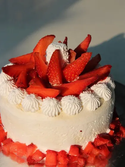 This lovely strawberry cream cake is light, fresh, and full of flavor. We use seasonal fruits to ensure the best taste, and like all our bakes, it's completely vegan and can be made gluten-free.