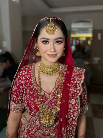 A close-up of this bride's flawless makeup. The skin is radiant, and the eyes are softly defined, creating a look that is both beautiful and comfortable to wear.