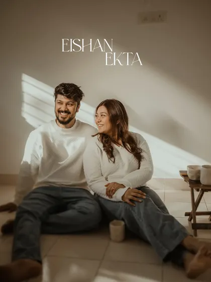 The beautiful morning light streaming through the blinds creates a lovely, warm atmosphere for this at-home couple portrait. It's simple, serene, and all about their connection.