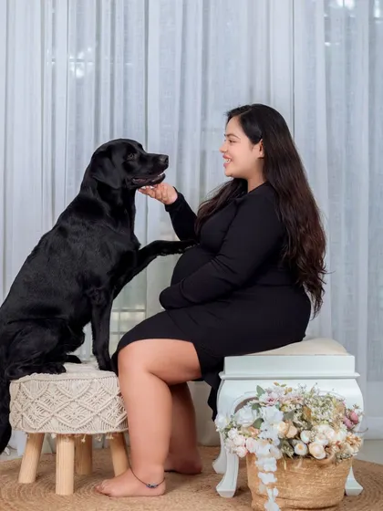 A sweet interaction between the mother-to-be and her fur baby. Including pets in your maternity shoot is a wonderful way to show who your family is.