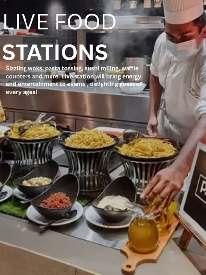 Live food stations bring energy and entertainment to any event. This image showcases a pasta station, a popular choice that delights guests of all ages.