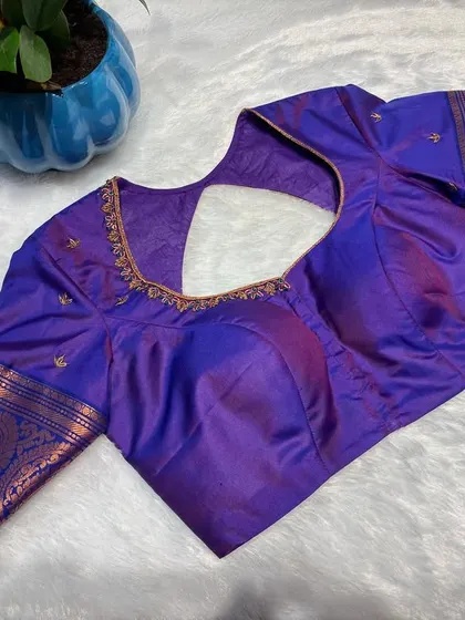 The front view of the royal purple blouse, showcasing its simple elegance.