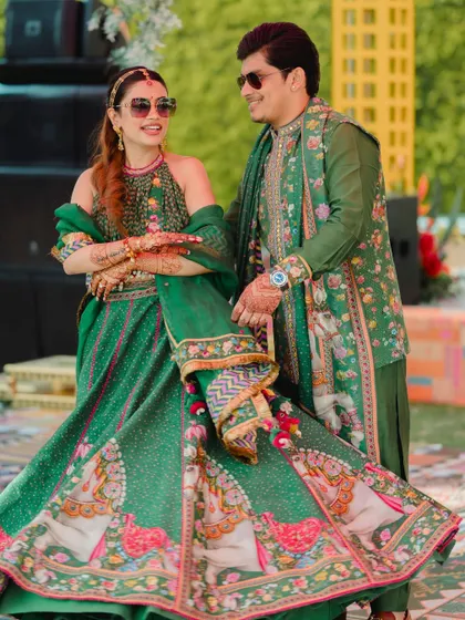 The couple sharing a dance at their Haldi. Their coordinated green outfits by Anita Dongre were a major style statement.
