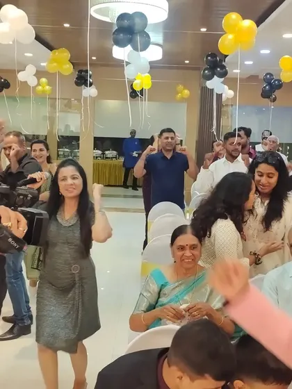 A candid shot of me dancing with the guests at a 50th birthday party. It's all about creating a friendly and energetic atmosphere where everyone feels comfortable celebrating.
