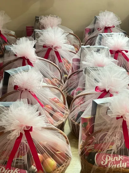 Another shot of the large order of 'Pink Lady' hampers, emphasizing the scale of the project.