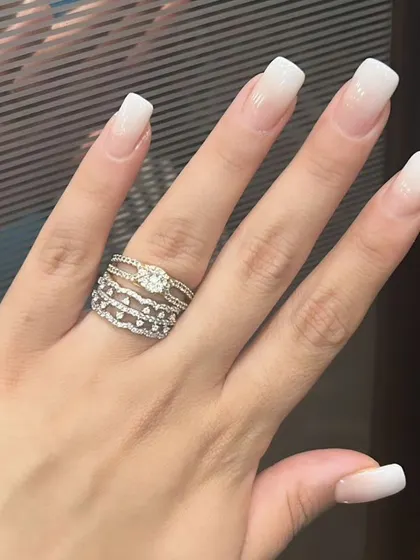 A soft and subtle baby boomer or ombre French manicure on square-shaped nails, blending white tips into a natural pink base.