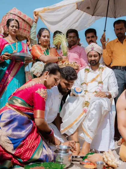 The traditional washing of the groom's feet by the bride's parents, a beautiful ritual of respect and welcome.