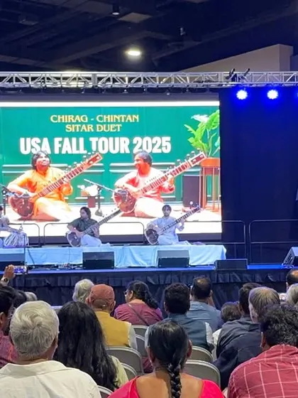 A wide shot of our concert stage during the USA Fall Tour. We often use a backdrop like this to create a visually appealing setting that complements the traditional music.