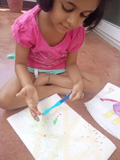 Even from home, our children's creativity shines. Here they are exploring different art techniques like spray painting and drawing, showing that learning and self-expression can happen anywhere.