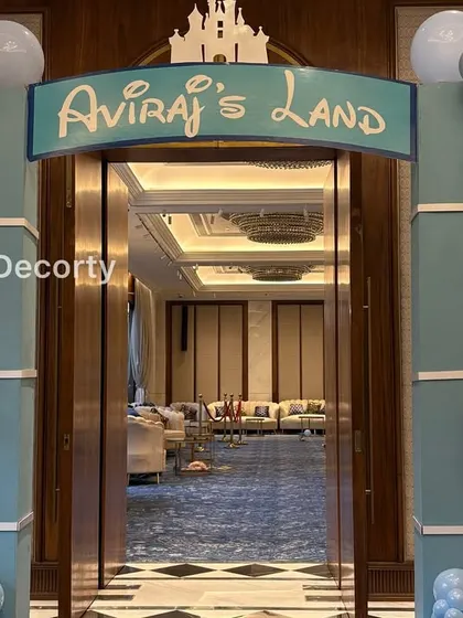 A detailed shot of the 'Aviraj's Land' entrance arch and the intricate balloon garlands.