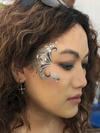 An elegant design combining blue swirls with a cascade of silver glitter.