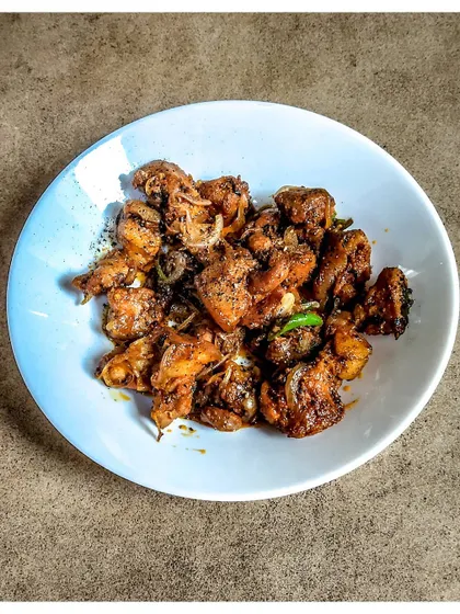 My Pork Pepper Fry is a simple and spicy dish. It's a quick stir-fry that packs a punch and is a great example of Bangalore-style pork preparations.