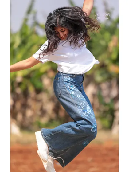A slightly different angle of my jump, showing off the hand-painted jeans. It's amazing how a little paint can completely revitalize an old piece of clothing.