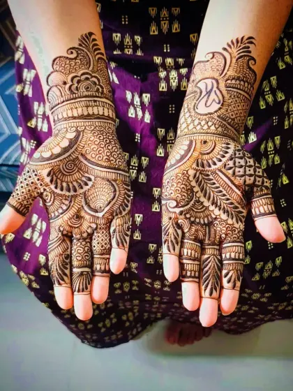This design is a beautiful example of traditional Rajasthani mehandi, with fine lines and detailed motifs covering the entire hand.