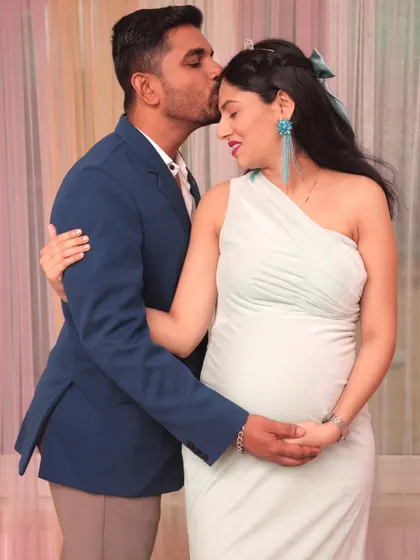 An intimate and loving gesture captured perfectly. These candid-style moments are a beautiful part of any couple's maternity shoot.