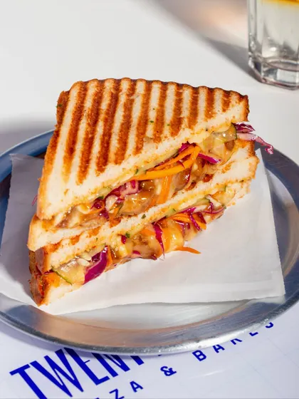 The full Togarashi Chicken Melt sandwich, perfectly grilled and ready to eat.