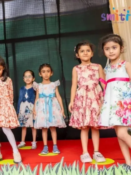 A group of girls stands proudly on stage after their performance. The sense of accomplishment they feel is a huge boost to their self-esteem.