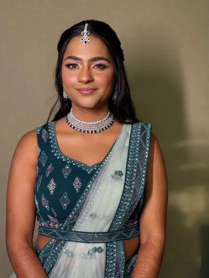 A portrait of modern elegance. The soft glam makeup, with its radiant finish, looks stunning with her diamond jewellery and contemporary lehenga.