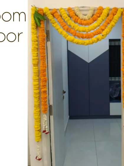 Decorating the doors inside the home for a housewarming. Simple marigold garlands bring a festive feel to every part of the house.