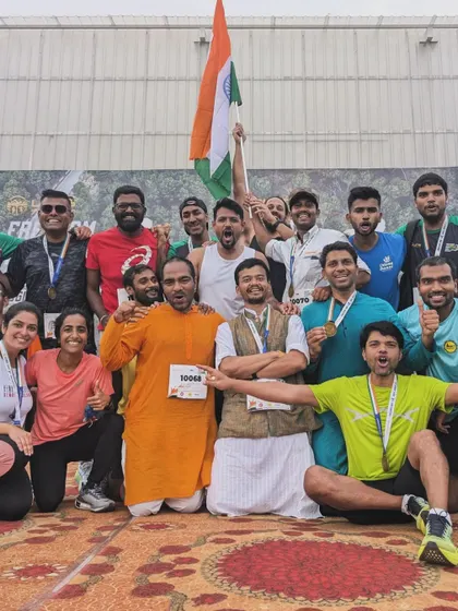 A group of triumphant runners celebrates together after the Freedom Run. This image perfectly captures the camaraderie and shared sense of accomplishment at our events.