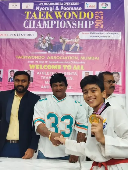 A proud moment for my student Yohansh Vyas, shaking hands with an official after winning a gold medal at the 3rd Maharashtra Open State Taekwondo Championship. His dedication is an inspiration.