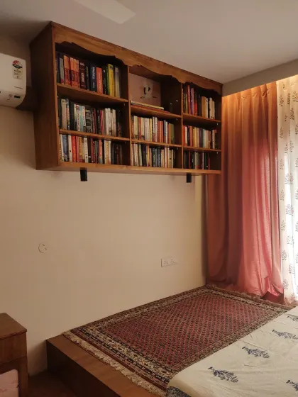 A side view of the floating bookshelf, showing its depth and sturdy construction.