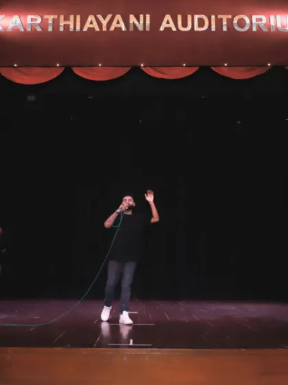 Commanding the stage at the Karthiyayani Auditorium for Tamasha 1.0. This shot shows my experience with large scale events and auditorium shows, proving I can handle any stage, big or small, and deliver a powerful performance.