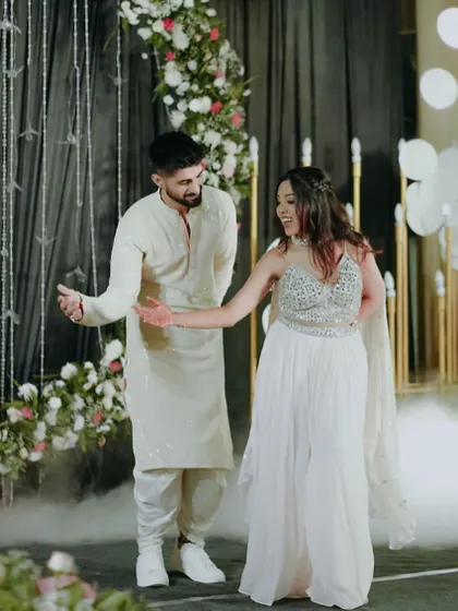 A beautiful shot of a couple dancing amidst smoke, creating a dreamy and ethereal atmosphere for their first dance.