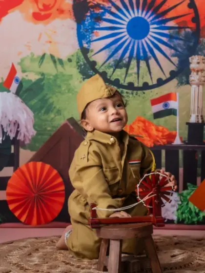 Dressed in pride, wrapped in freedom. This little one is celebrating the spirit of India.