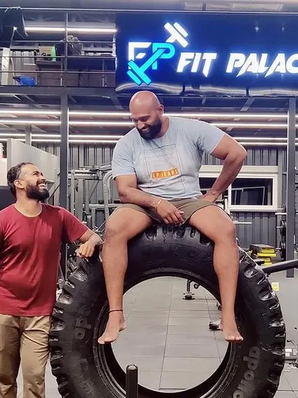 Sharing a laugh with a friend at the gym. The community aspect is key.