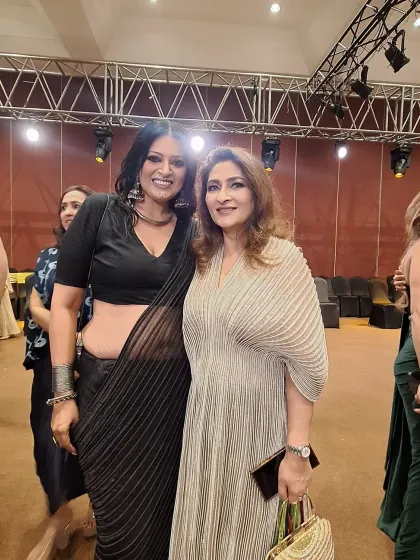 With a guest at the Vaishali S. handloom showcase. The beauty of a black saree is its versatility; it can be styled to be classic, edgy, or glamorous.