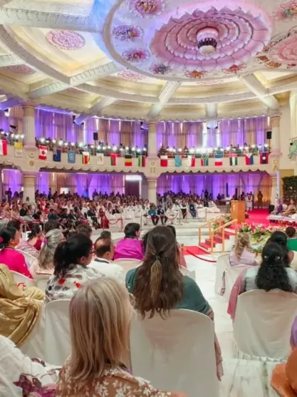 A wide view of the hall during the International Women's Conference. Delegates from many countries gathered to celebrate strength, wisdom, and the collective power of women.