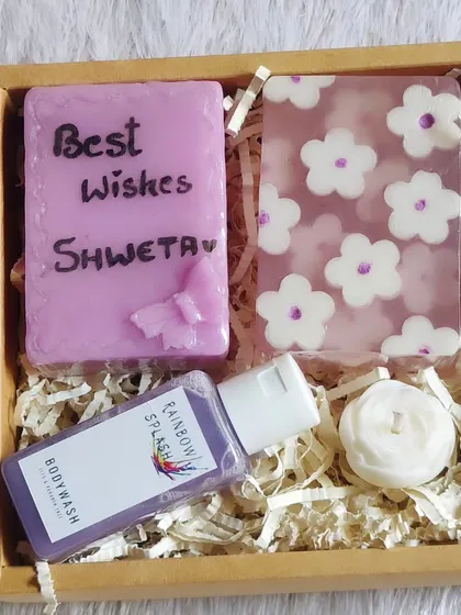 A lovely lavender-themed gift hamper with a personalized "Best Wishes Shweta" soap, body wash, and a small candle.