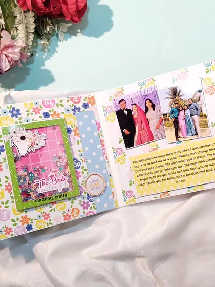 A page from a bridal scrapbook with a shaker window and messages.
