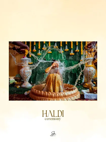 A beautifully framed action shot of the Haldi water ritual, presented with an artistic touch.