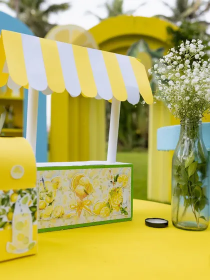 A miniature lemonade stand prop, a cute detail for the dessert table.