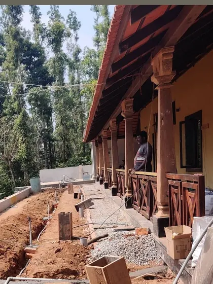 This is a duplicate of ID 111. The veranda of the Sakleshpur bungalow during its modernization.